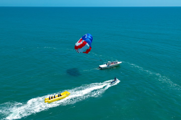a group of people riding skis on a body of water