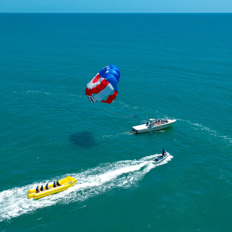 a group of people riding skis on a body of water