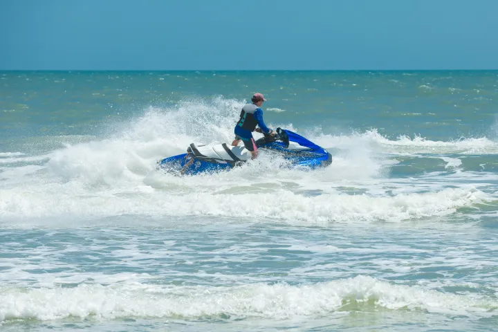 a man riding a wave on a surfboard in the ocean