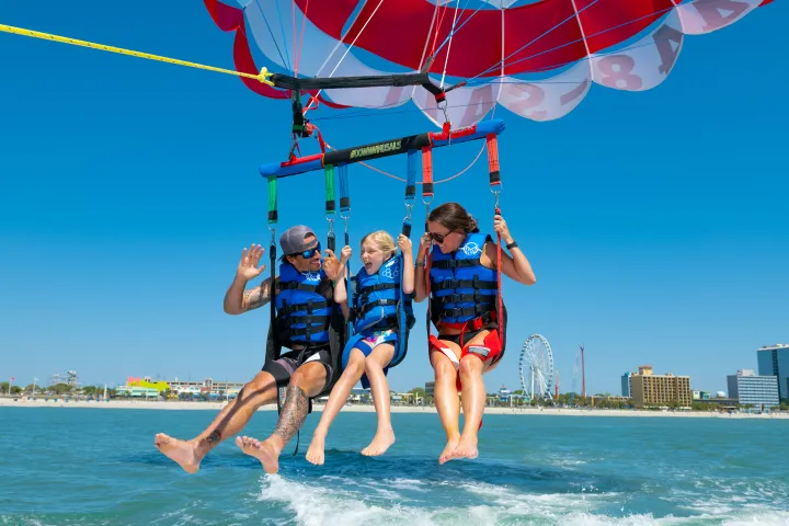 a person standing next to a body of water