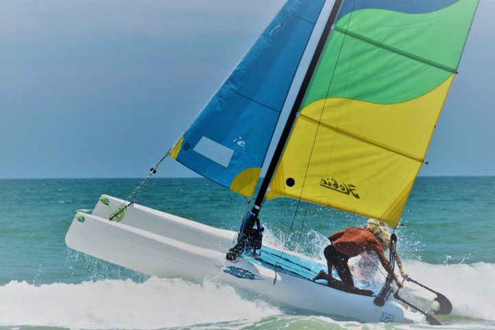 a man sailing a rental sailboat in myrtle beach