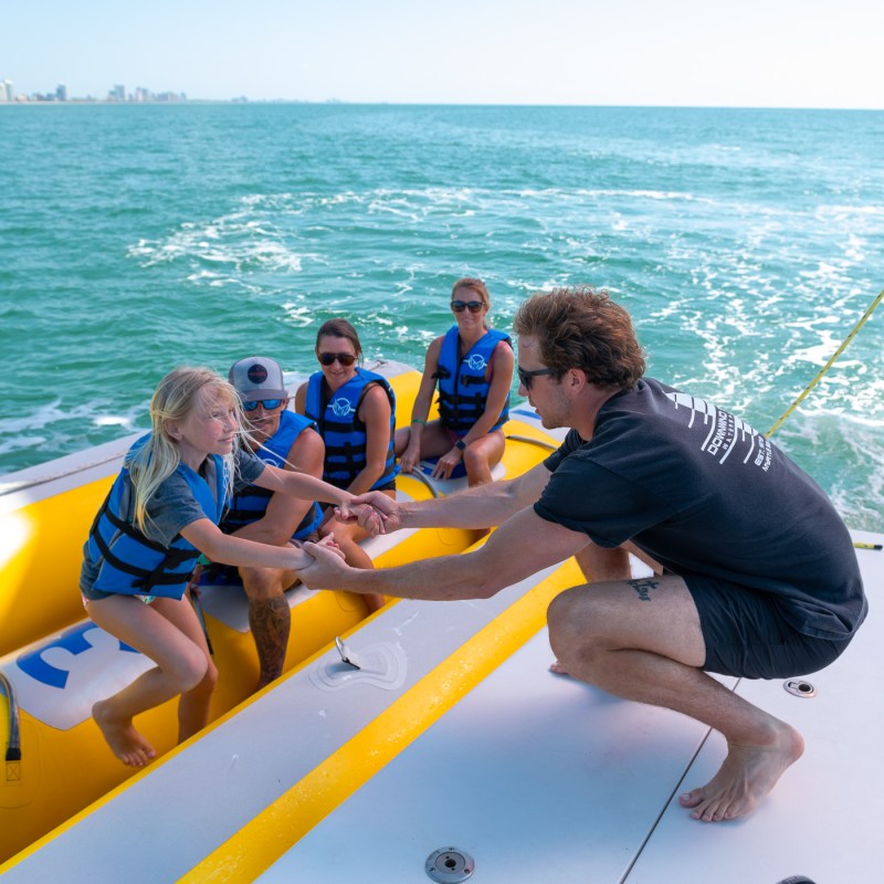 a group of people on a boat in the water