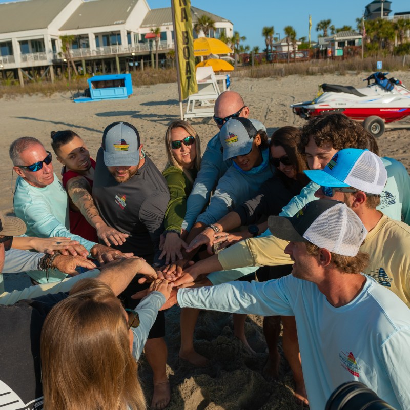 a group of people standing in front of a crowd