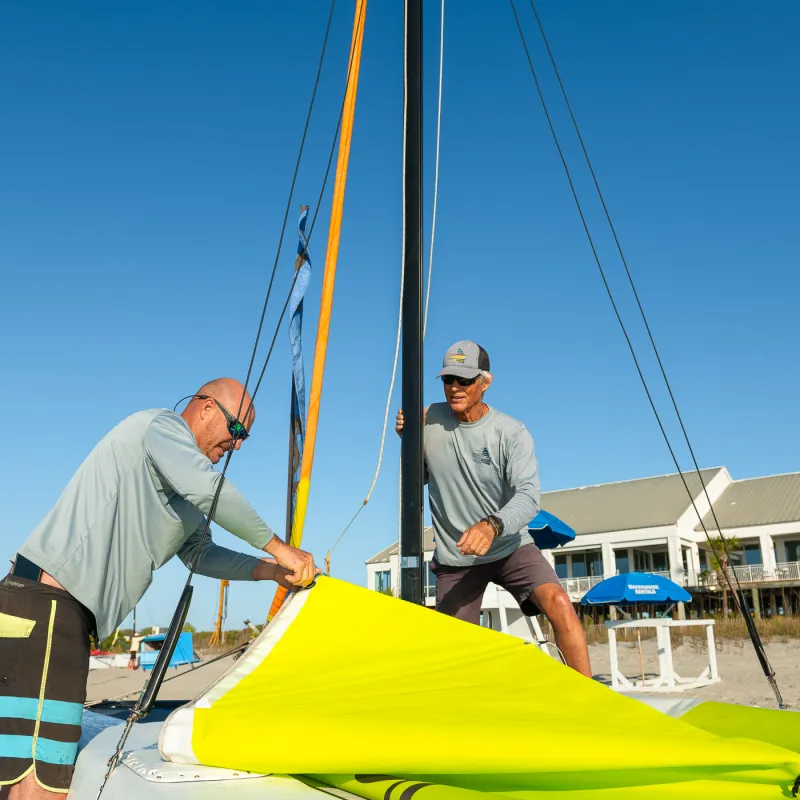 a man holding a kite in a boat